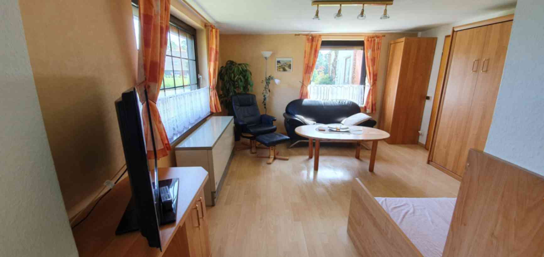 Gemütliches Wohnzimmer der Ferienwohnung An der Harle